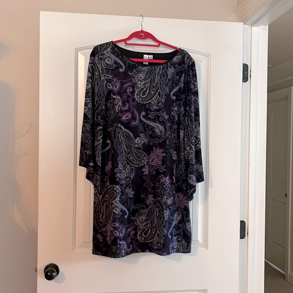 Super cute paisley print, bell sleeved dress in shades of violet and black.